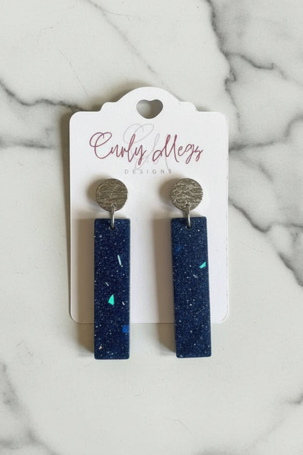 Curly Megs Designs midnight blue glitter inlay rectangular dangle earrings with silver-toned textured studs.