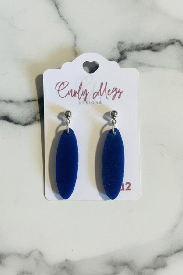 Curly Megs Designs deep blue oval dangle earrings with velvety texture.