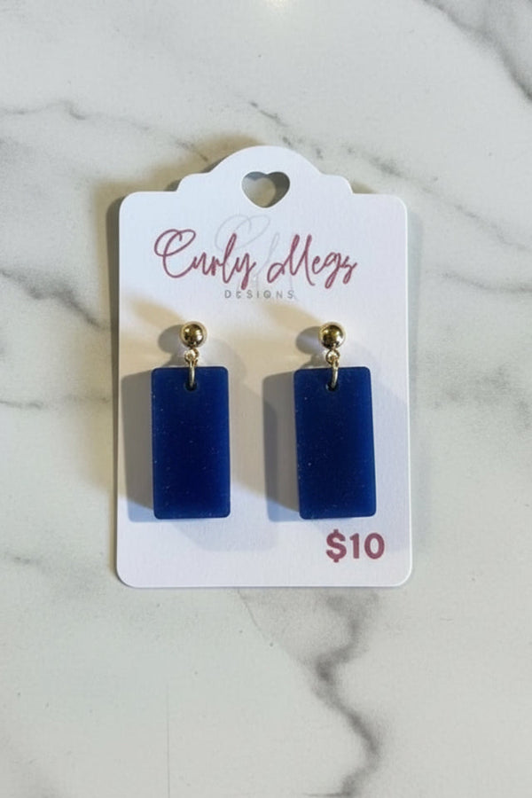Curly Megs Designs rectangular dangle earrings in deep blue with a velvety texture and gold ball accent.