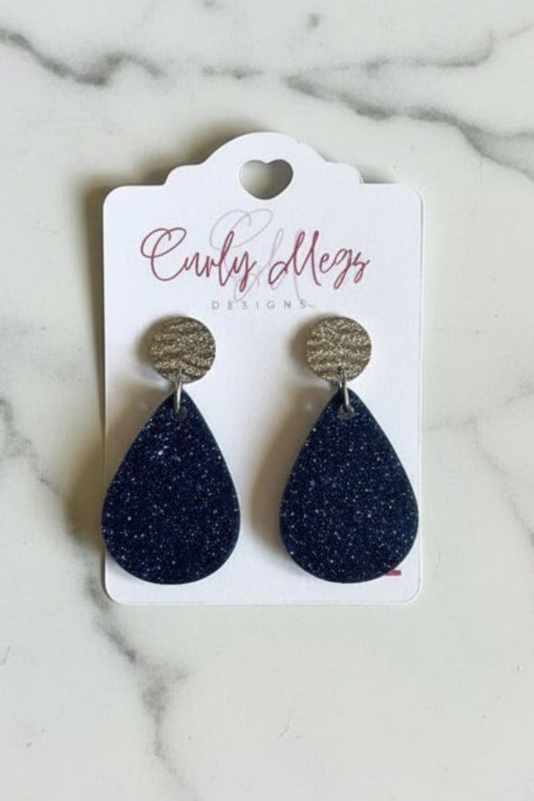 Curly Megs Designs navy blue glitter teardrop dangle earrings with silver-toned textured stud tops.