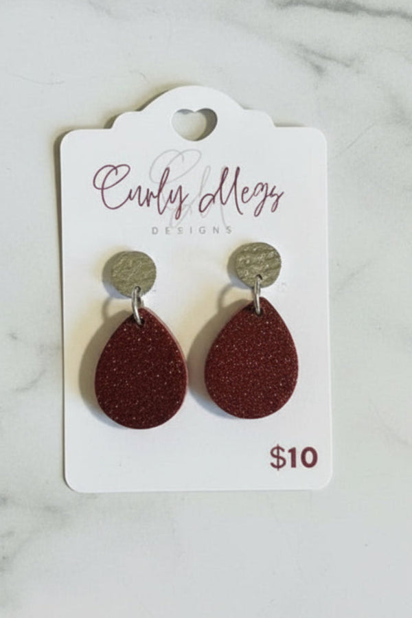 Curly Megs Designs teardrop glitter earrings in deep red with textured silver-tone stud tops.