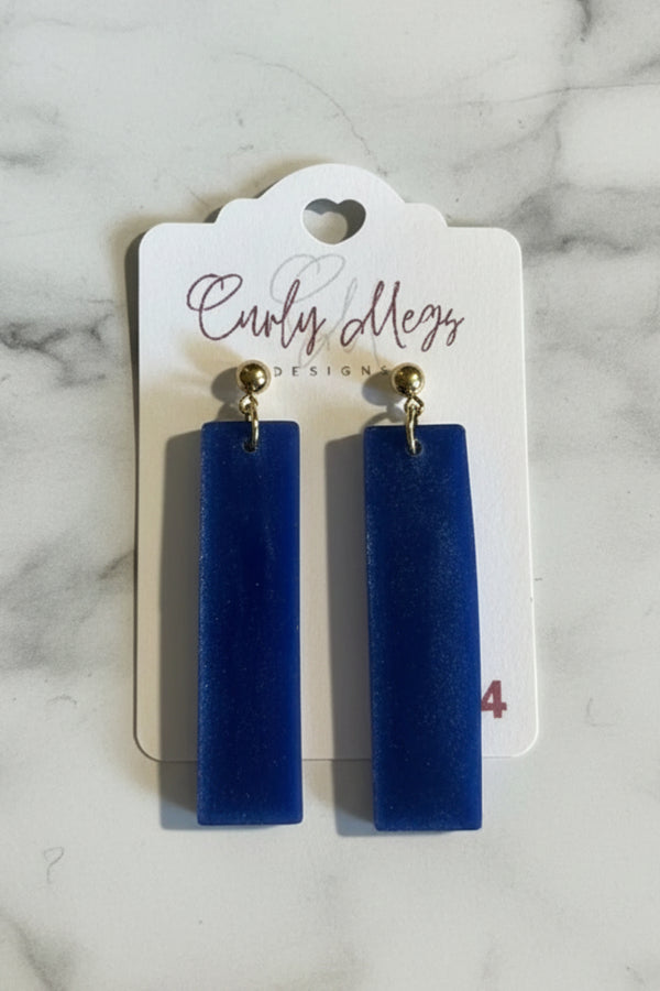 Curly Megs Designs royal blue resin rectangular dangle earrings with gold posts. Modern minimalist style.